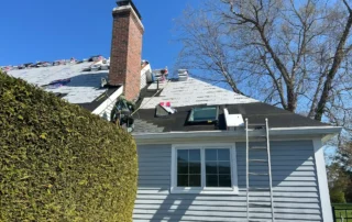 Custom roof replacement, ridge vent installation, and Velux skylight replacement project in Charlestown RI by Pawcatuck Roofing Company.