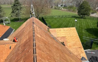 Affordable roof replacement, ridge vent installation, and Velux skylight replacement completed in Charlestown RI by Pawcatuck Roofing Company.