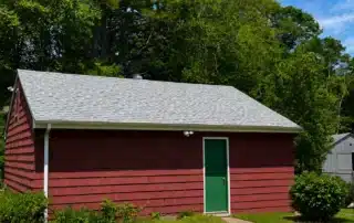 Professional residential and garage roof replacement project completed in Charlestown RI by Pawcatuck Roofing Company.