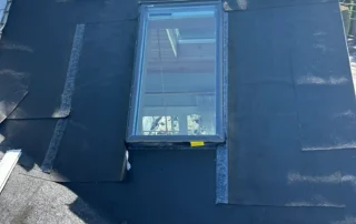 Local roof replacement, ridge vent installation, and Velux skylight replacement service in Charlestown RI by Pawcatuck Roofing Company.