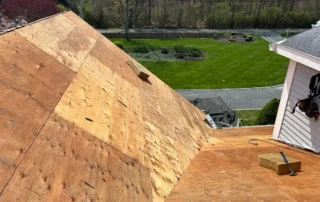 Premier roof replacement, ridge vent installation, and Velux skylight replacement completed for a Charlestown RI home by Pawcatuck Roofing Company.