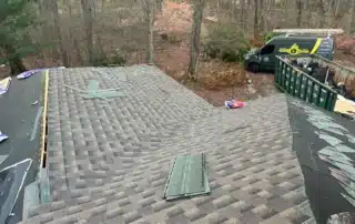 Efficient roof replacement and Broan vent installation work performed in Stonington CT by Pawcatuck Roofing Company.