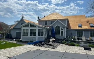 Efficient roof replacement, ridge vent installation, and Velux skylight replacement work performed in Charlestown RI by Pawcatuck Roofing Company.
