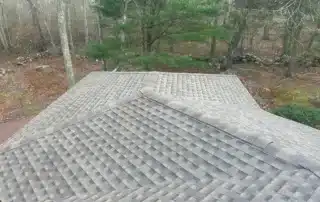 Expert roof replacement and Broan vent installation project completed in Stonington CT by Pawcatuck Roofing Company.
