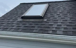 Expert roof replacement, ridge vent installation, and Velux skylight replacement project completed in Charlestown RI by Pawcatuck Roofing Company.