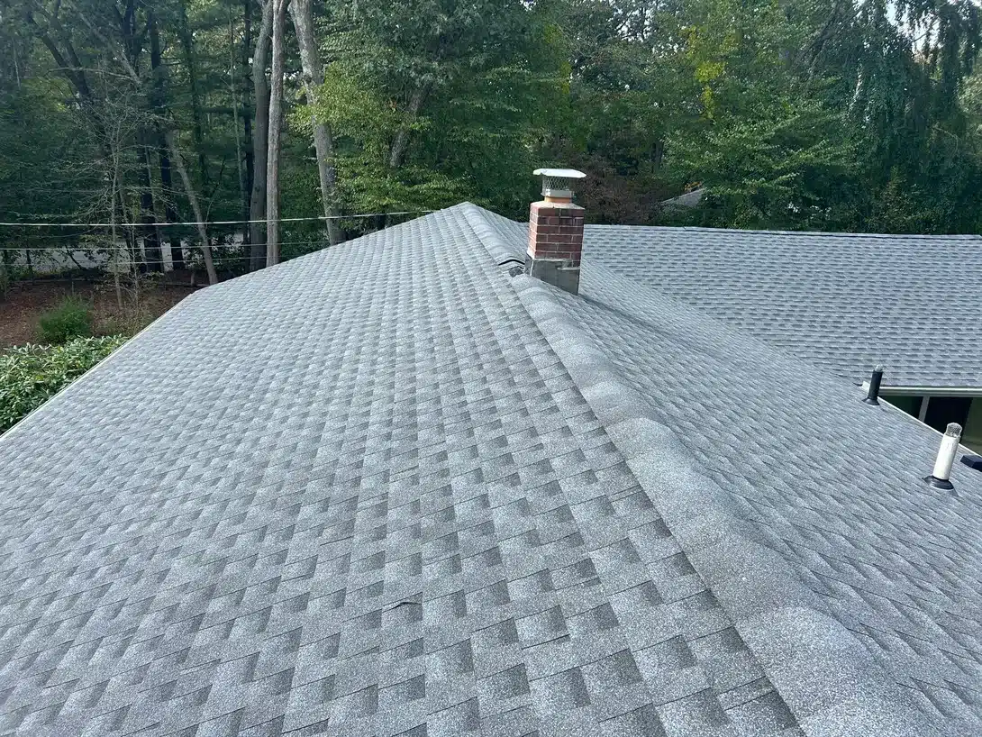 Durable roof replacement, ridge vent installation, and gutter guard upgrade solution provided in Westerly RI by Pawcatuck Roofing Company.