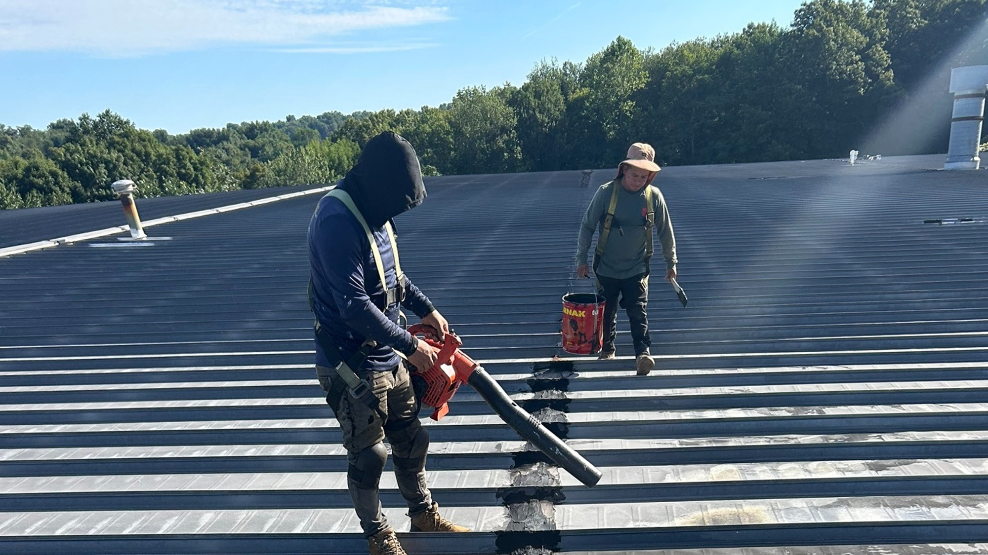 Commercial roofers in CT preparing a roof for winter